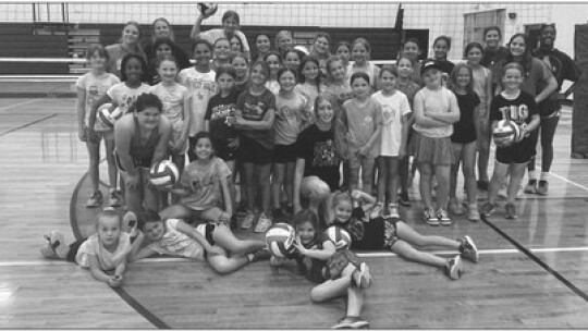 The Thrall Tigerettes from grades second through eighth gather for a group photo following the volleyball portion of the summer all-sports camp.