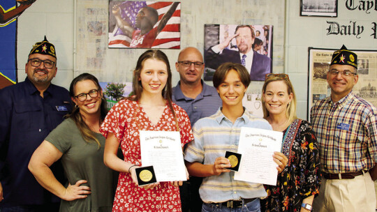 The top eighth graders from Taylor Middle School received a scholastic excel award from the American Legion Graham D. Luhn Post39 in Taylor. The award was presented to (front row, from left) Callie Kloppe and Ben Bachmayer. Joining them at the presentation was (from left) Dwayne Ariola, Po...