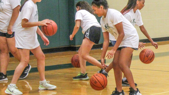 Taylor girls campers from the older group dribble basketballs on June 8 during the Lady Ducks Youth Basketball Camp.