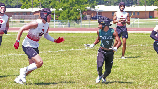 Taylor varsity football junior cornerback Ethan Flagg drops back into coverage against Lorena High School during the 7-on-7 state qualifying tournament held in Cameron.