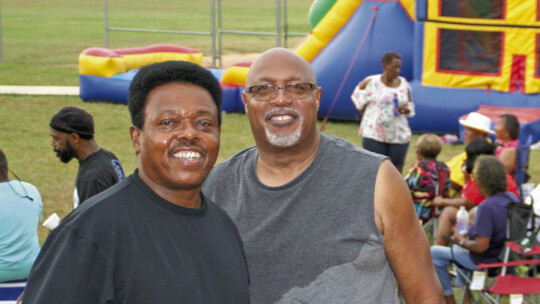 Friends Quinn James and Carl Caldwell smile at the Juneteenth celebration hosted by Southside Community Engagement, June 19, at Fannie Robinson Park, 206 S. Dolan St. Photo by Grace Horvath