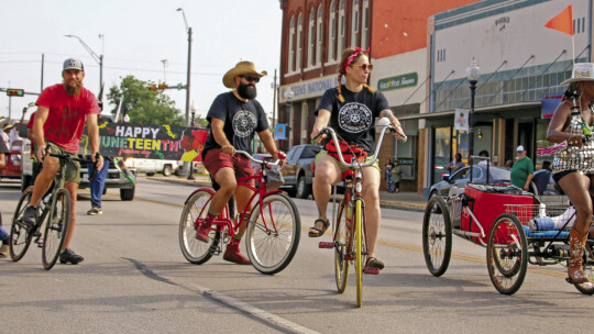 A group of local riders represent the Taylor Bike Co. in the Juneteenth parade. Photo by Jason Hennington