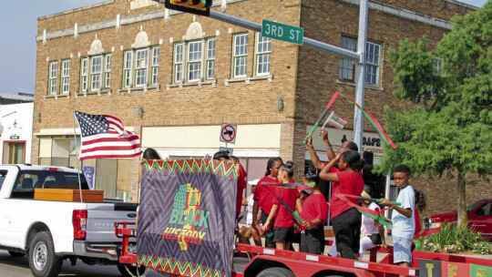 Floats represented and celebrated Juneteenth Monday morning as they rode in the parade. Photo by Jason Hennington