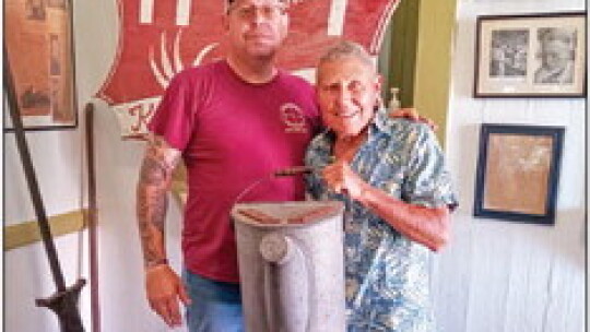 Jonathan Jones, Coupland Civic Organization board member (left), and Hollywood cameraman Cal Roberts in the historic Coupland Depot. Photo by Susan Garry