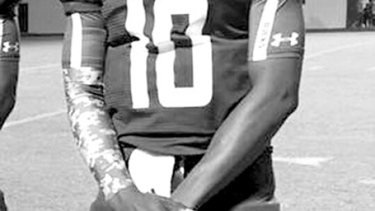 Former Taylor High School quarterback Terrell Reynolds poses for a photo after a game as a senior during the Fall of 2015. Courtesy photo