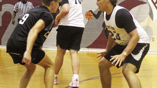 Taylor boys varsity basketball junior Harrison Tate locks in defensively against Cedar Creek on June 26 during a Ducks summer league scrimmage in Bastrop.