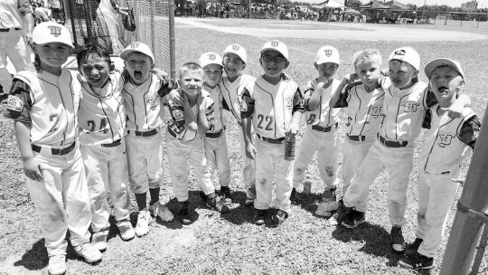 The Taylor Ducks 6U baseball players celebrate together after a game during the 2023 season.