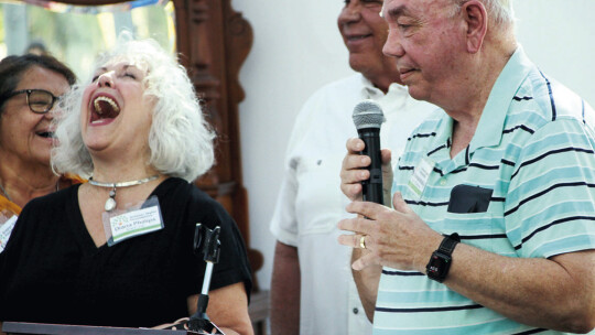 Board Chair Diana Phillips laughs during donor Ed Komandosky’s speech. Komandosky has served on Taylor boards and committees for more than 40 years.