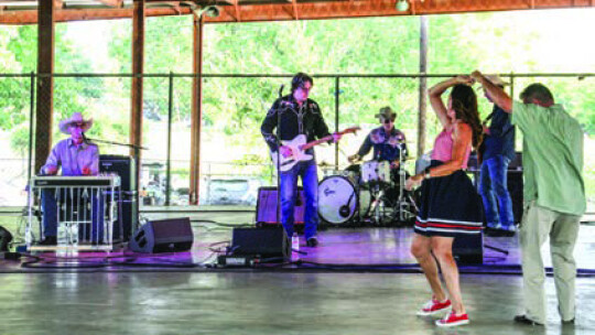 The Derailers played country music while attendees danced along to the music in the shade of the Murphy Park Pavillion July 4 . Photo by Grace Horvath