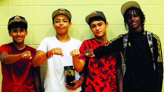 The 2023 Taylor Press 3-on-3 Basketball Tournament champions of the 11–14 division are the Lightning Bombers. Team members are (from left) Paulo Torres, Markell Fitzgerald, Davian Tellez and Aiden James.