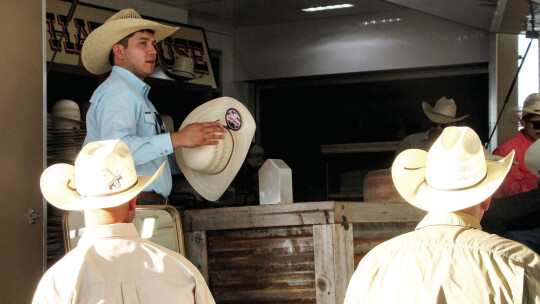 Double R Hat House employee uses steam to help shape cowboy hat for customers. Photo by Hunter Dworaczyk