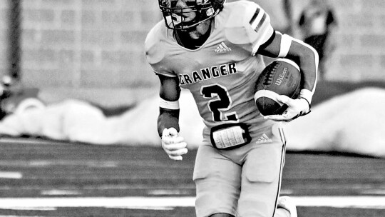 Lions varsity football cornerback Isaac Lizardo returns a kickoff on Sept. 2, 2022, during a Granger home game vs. Thorndale High School. Photo by Larry Pelchat.