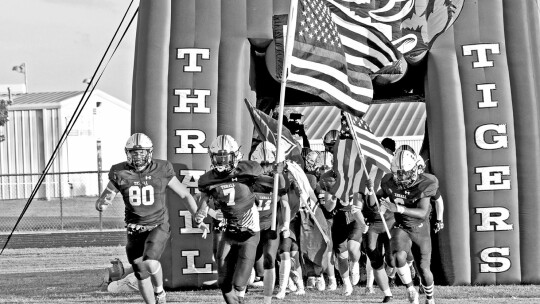 Thrall High School varsity football runs out onto the field on Aug. 26, 2022, prior to the Tigers’ 47-8 home victory over Somerville High School. Photo by Larry Pelchat