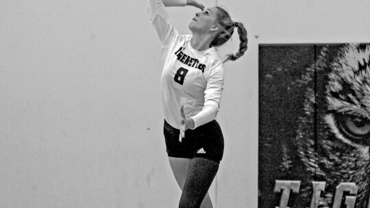 Tigerettes varsity volleyball setter Emily Holybee serves the ball on Sept. 13, 2022, during a Thrall home match win vs. Snook High School. Photo by Larry Pelchat