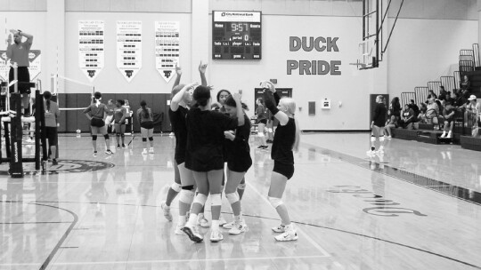 Lady Ducks varsity volleyball celebrates after scoring a point against Thrall High School on Aug. 5, 2022, during a preseason scrimmage held at Taylor High School.