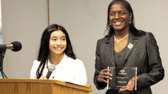 Amy Robles (left) presents Velma Nealy (right) with the Staff of the Year award at the Boys and Girls Club of East Williamson County banquet. Robles won the Junior Youth of the Year award.