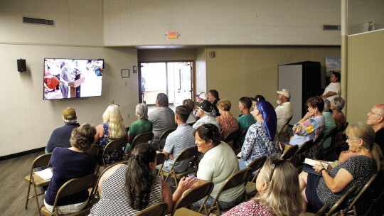 Taylor residents listen to the meeting in an overflow room. Capacity in the main meeting room was full. Photo by Hunter Dworaczyk