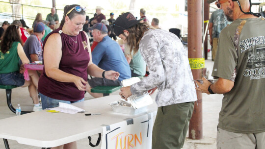 Contestants deliver entries to judges for tasting. There were 78 teams who had an opportunity to compete in several different categories.