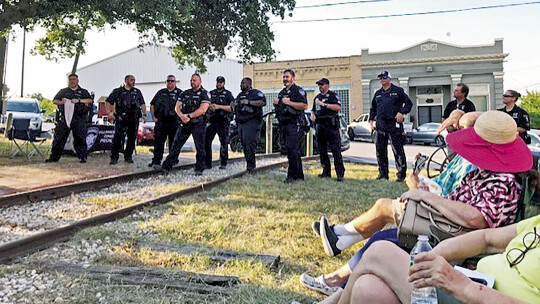 Officers from Constable Leal’s office are ready to enjoy Coupland’s National Night Out supper. Photos by Susan Garry