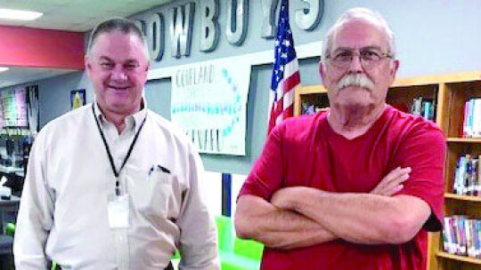 At the community meeting regarding the Coupland school superintendent search, interim superintendent Adren Pilger, left, visits with Coupland City Alderman Russell Schmidt.