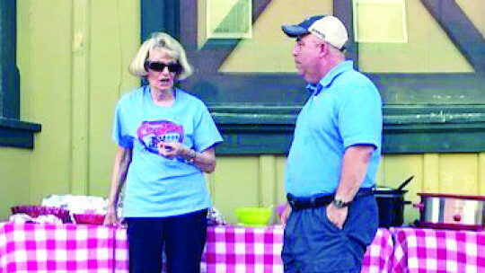 At Coupland’s National Night Out event, Depot Coordinator Barbara Piper introduces St. Peter’s new permanent Pastor Scott Wasdin. Photos by Susan Garry