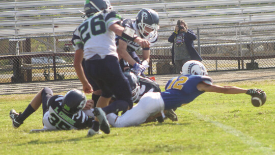 St. Mary’s Catholic School varsity football junior running back Ethan Lively stretches the ball over the goal line for a touchdown on Aug. 26 during the first quarter of the Rams’ 56-8 victory at home vs. Williamson County Home School. Photos by Andrew Salmi