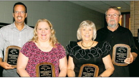 Barbara Leschber (second from right) stands with fellow 2015 Taylor ISD retirees (from left) James Fisher, Kathie Preece and Mike Tennill.