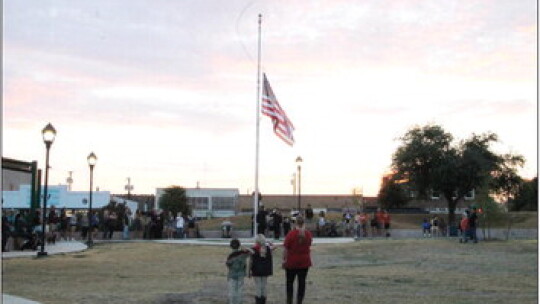 During the middle of the Patriot Day Remembrance ceremony, the flag was solemnly raised to honor those who died because of the Sept. 11, 2001 attacks. Photo by Hunter Dworaczyk