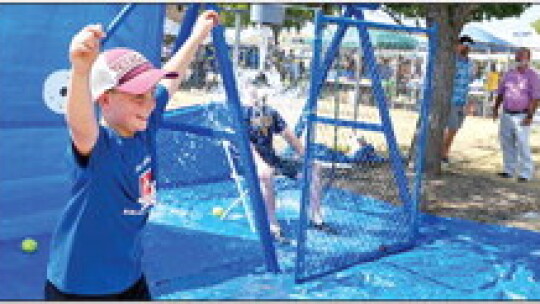 St. Mary’s third grader, Kase Izard, celebrates after dunking St. Mary’s teacher Daniel Yezak. Photo courtesy of Tessa Streit