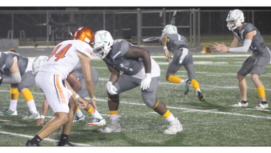 Ducks varsity football senior offensive tackle Syris Corley prepares for the snap on Sept. 15 during Taylor’s 49-19 win against Smithville.